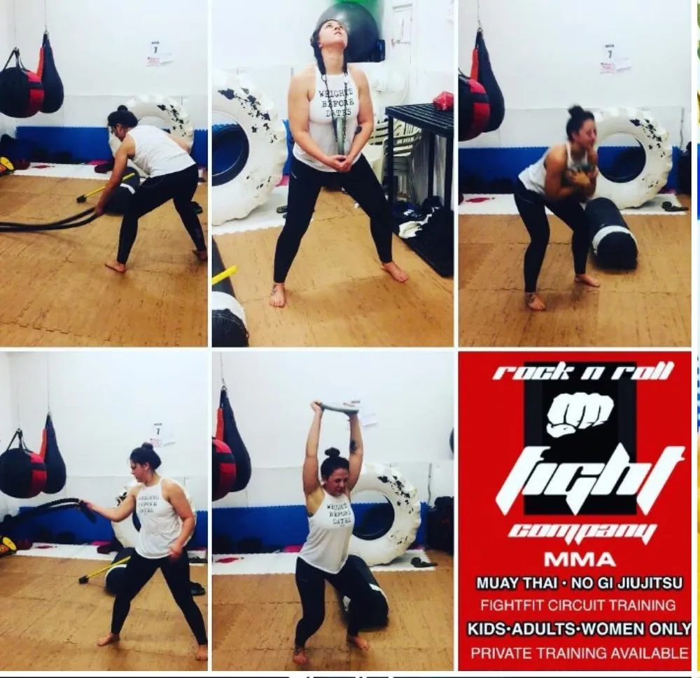 A student working battle ropes, a chain carry and a tractor tire in a FightFit circuit